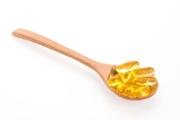 Fish oil in wooden spoon