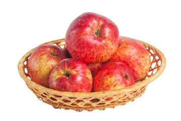 Many red apples in a wicker plate