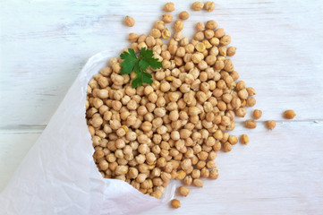 Hummus, chick peas on a vintage wooden background