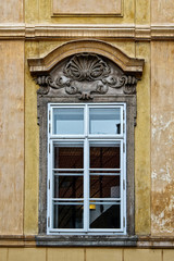 Fototapeta na wymiar Window with pediment in Prague, Czech Republic
