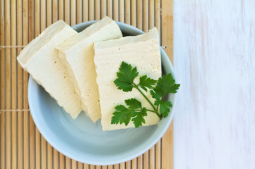 Sliced Tofu on a vintage wooden background