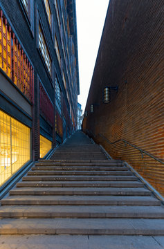 Steps leading up a dark modern alleyway