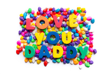 love you daddy word in colorful stone