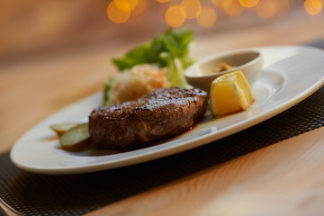 steak with sauce and vegetables