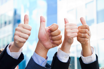 Business People with Thumbs Up