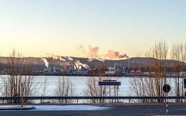 Fototapeta na wymiar Industrial Buildings by Ocean in Sweden
