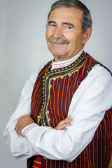 Pipe player in traditional clothing