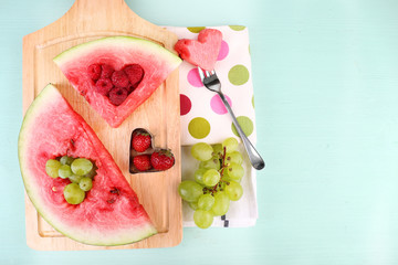 Fresh juicy watermelon slice  with cut out heart shape, filled