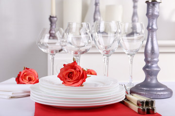 Festive table setting on room background