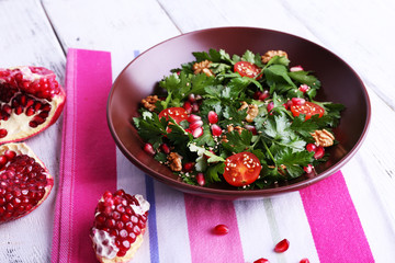 Fresh salad with greens, garnet and spices