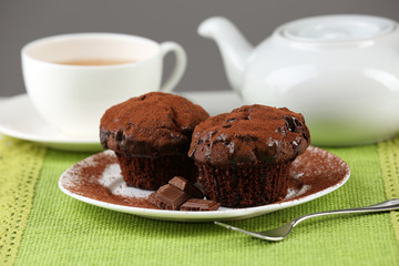Yummy chocolate cupcake on table