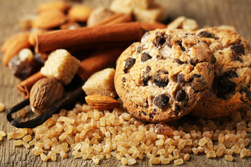 Christmas spices and baking ingredients on wooden background