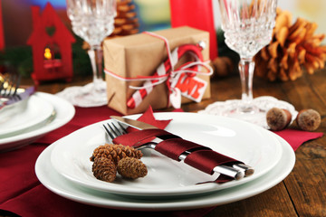 Holiday table setting with Christmas decoration background