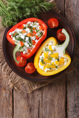 Fresh peppers stuffed with cottage cheese top view vertical