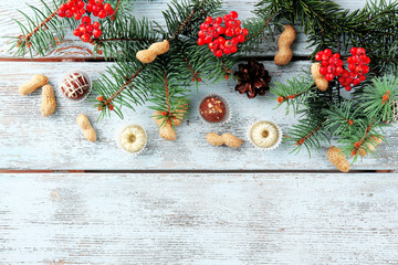 Chocolates with hazelnuts and sprigs of Christmas tree