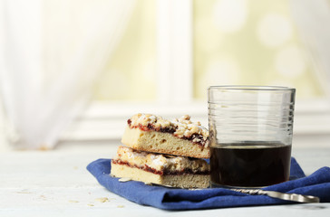Glass of espresso and tasty homemade pie on wooden table
