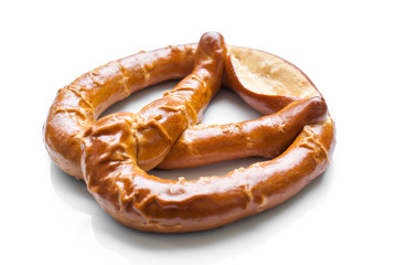 Appetizing pretzel on white background