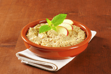 Oatmeal porridge with sliced apple