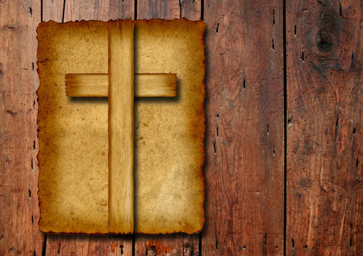 Old vintage Christian paper cross on wood