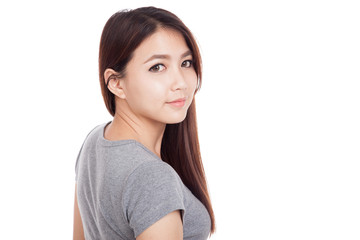 Fototapeta premium Young Asian woman turn back to camera