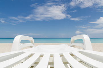 Obraz na płótnie Canvas deckchair on a beach, seashore