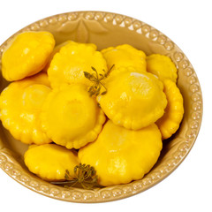 Pickled Pattypan Squash on white background. Selective focus.