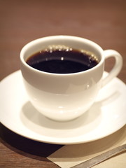 Cup of black hot coffee at coffee shop