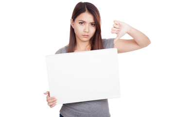 Young Asian woman thumbs down with blank sign