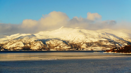 Mountain rising above the frozen lake