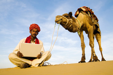 Indigenous Indian Man Laptop Desert Concept