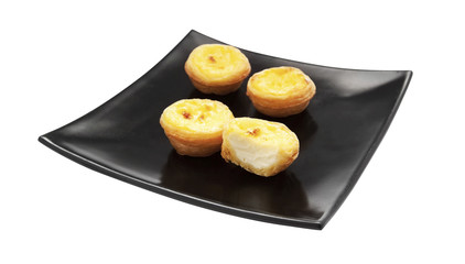 Egg tarts on black plate