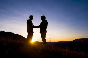 Fototapeta na wymiar Business Meeting On The Mountain Handshake Concept