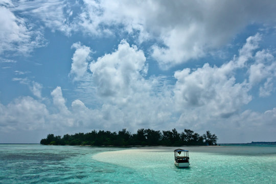 Boat near an island in tropical ocean near Karimunjawa