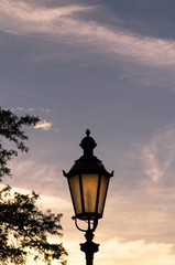 Fototapeta na wymiar Street lamp on background of sky