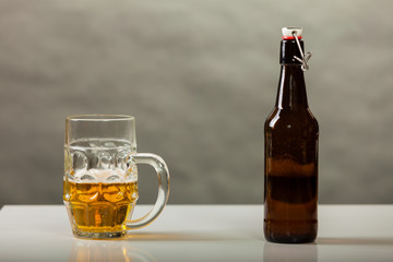 beer mug and bottle on table