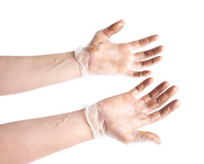 Worker's hands in a dirty gloves isolated