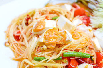 Close up of green papaya salad with salted egg