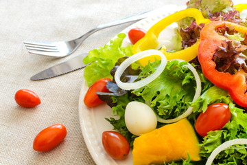Close up of fresh salad on sackcloth