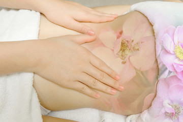 Woman having massage of body in the spa salon
