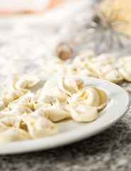 Raw Ravioli Pasta In Plate On Countertop