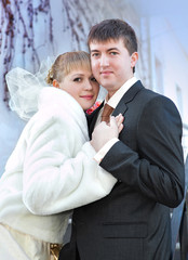 Happy bride and groom on wedding day sky background