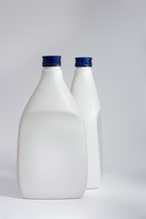 Two white plastic bottles