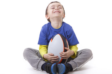 child with rugby ball