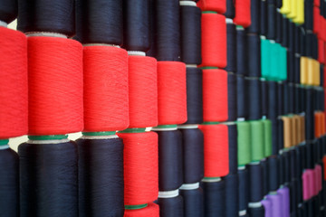 Row of colorful sewing thread