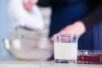 Mixing  egg cream in bowl with motor mixer, baking cake