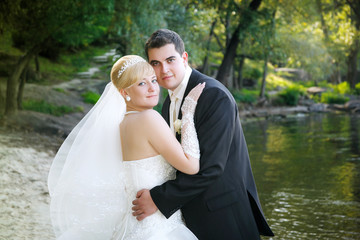 Happy bride and groom on the beach