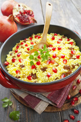 Couscous with pomegranate, raisins and spices