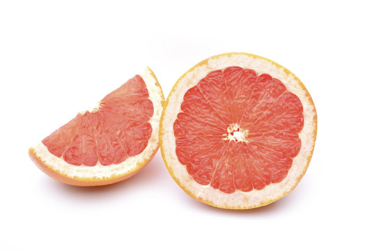 Grapefruit slices on white background