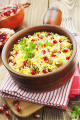 Couscous with pomegranate, raisins and spices