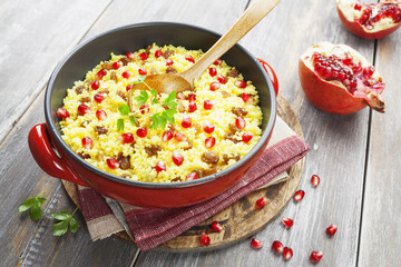 Couscous with pomegranate, raisins and spices
